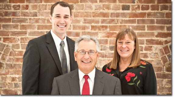 Group portrait of Brian G. Roberts, James G. Roberts and Dee D. Reiter